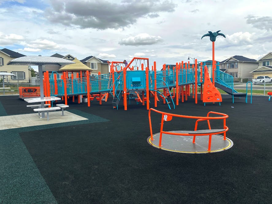 Ted Harrison School Inclusive Playground - Outdoor playground in Northeast Calgary